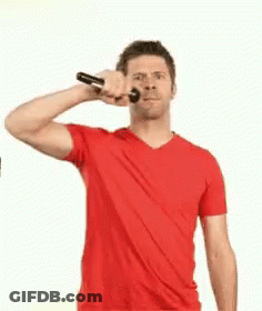 Man In Red Shirt Brushing Teeth GIF