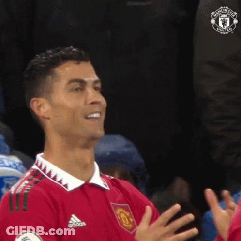 Man In Red Shirt Clapping In Stadium GIF