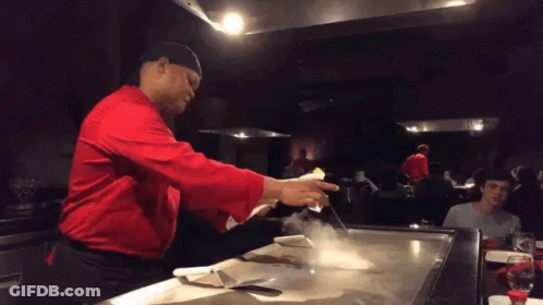 Man In Red Shirt Cooking On Stove GIF