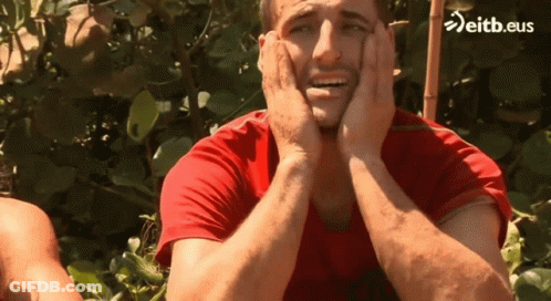Man In Red Shirt Covering Face GIF