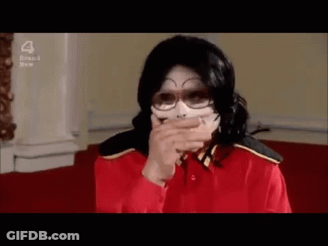 Man In Red Shirt Covering Mouth GIF