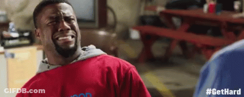 Man In Red Shirt Crying At Picnic Table In Garage GIF