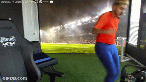 Man In Red Shirt Dancing In Front Of Castro Chair GIF