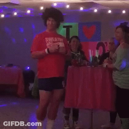 Man In Red Shirt Dancing In Room With Lights GIF