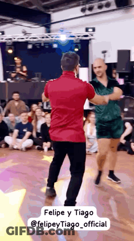 Man In Red Shirt Dancing With Man In Green Dress GIF