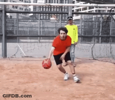 Man In Red Shirt Dribbling Basketball GIF