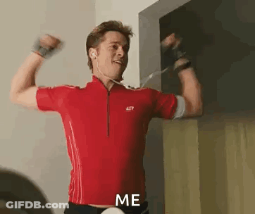 Man In Red Shirt Flexing Muscles GIF