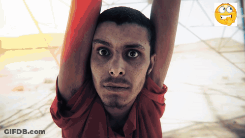 Man In Red Shirt Hanging Upside Down Arms In Air GIF
