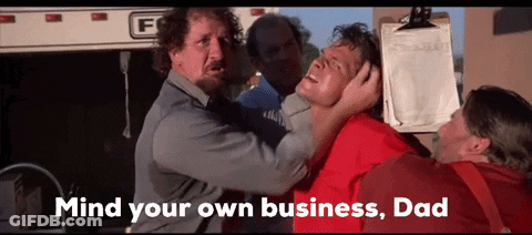 Man In Red Shirt Held By Group Saying Mind Your Own Business Dad GIF