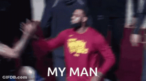 Man In Red Shirt High-Fiving Another Man GIF