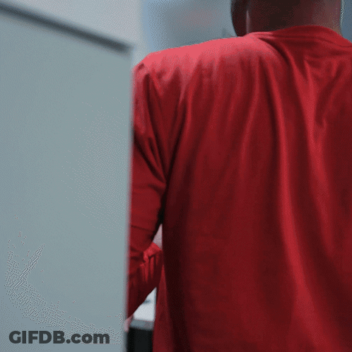Man In Red Shirt Holding Bottle GIF