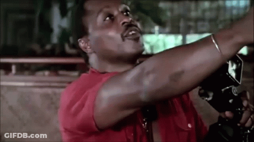 Man In Red Shirt Holding Camera Over Head GIF