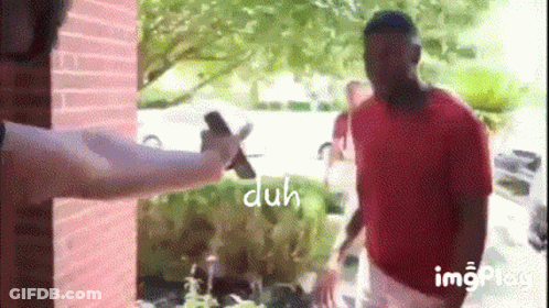 Man In Red Shirt Holding Cell Phone GIF
