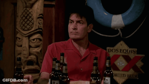 Man In Red Shirt Holding Dos Equis GIF