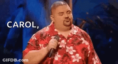 Man In Red Shirt Holding Microphone Singing GIF