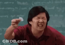 Man In Red Shirt Holding Paper GIF