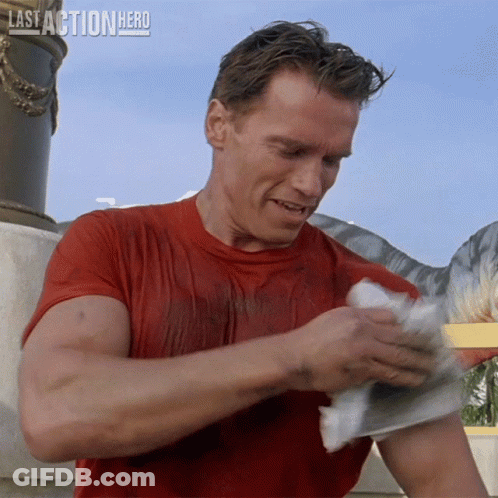 Man In Red Shirt Holding Paper Last Action Hero GIF