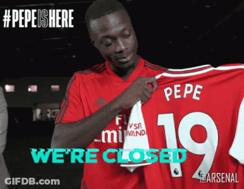 Man In Red Shirt Holding Pepe Jersey GIF