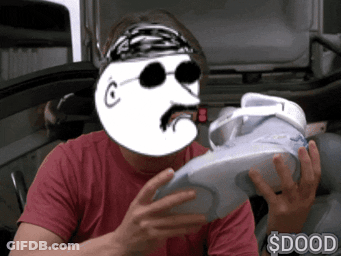 Man In Red Shirt Holding Shoe With Cartoon Face $ Dood GIF