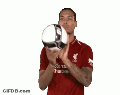 Man In Red Shirt Holding Soccer Ball GIF