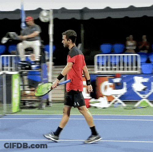 Man In Red Shirt Holding Tennis Racket GIF