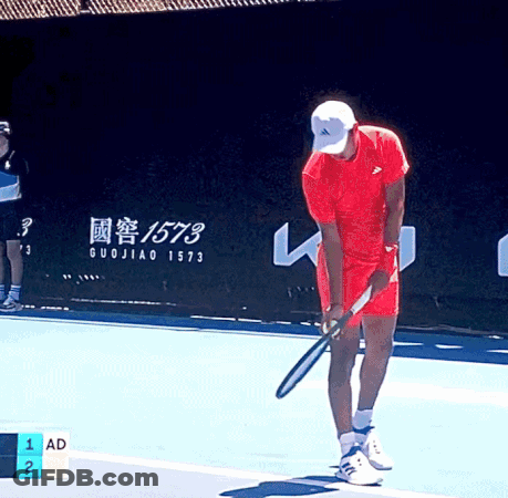 Man In Red Shirt Holding Tennis Racquet GIF