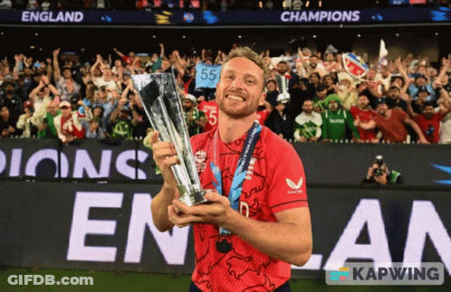 Man In Red Shirt Holding Trophy GIF