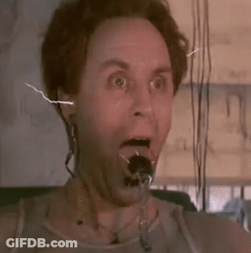 Man In Red Shirt Holding Yellow Frisbee At Expedia Sign GIF
