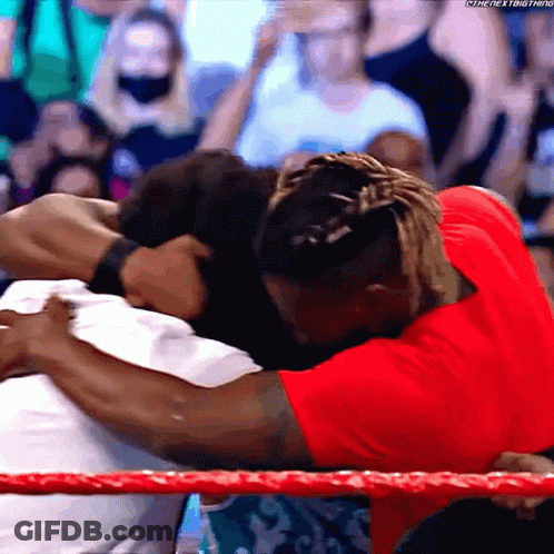 Man In Red Shirt Hugging Another GIF