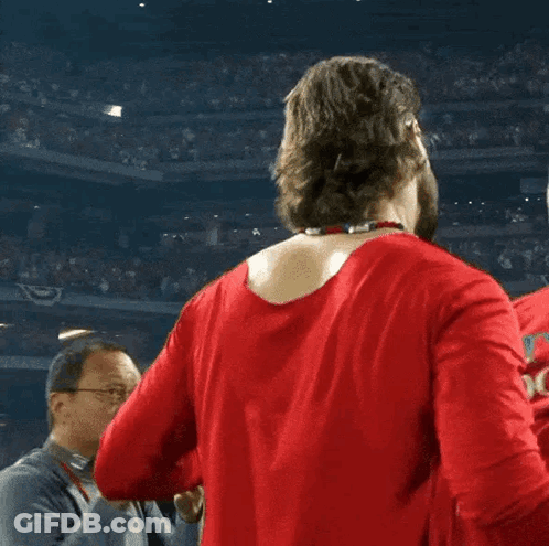 Man In Red Shirt Hugging Man In Red Hat GIF