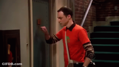 Man In Red Shirt In Front Of Door Saying Comique De Repetition GIF