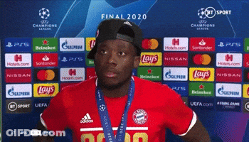 Man In Red Shirt In Front Of Final 2020 Backdrop GIF