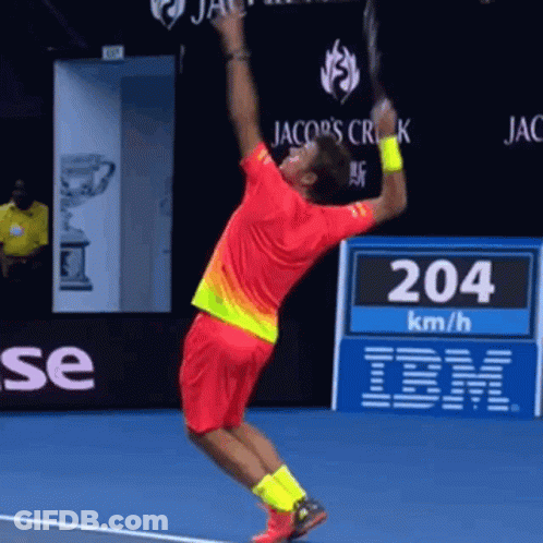 Man In Red Shirt Jumping Holding Tennis Racquet GIF
