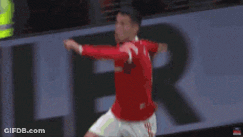 Man In Red Shirt Jumping Soccer GIF