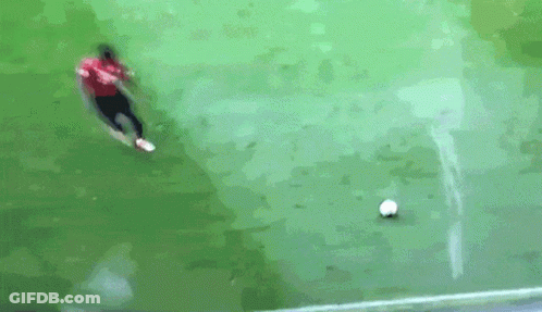 Man In Red Shirt Kicking Soccer Ball GIF