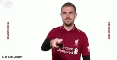 Man In Red Shirt Kicking Soccer Ball GIF