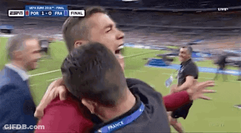Man In Red Shirt Kicking Soccer Ball On Field GIF