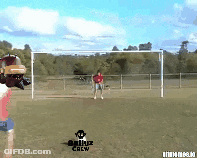 Man In Red Shirt Kicking Soccer Ball GIF