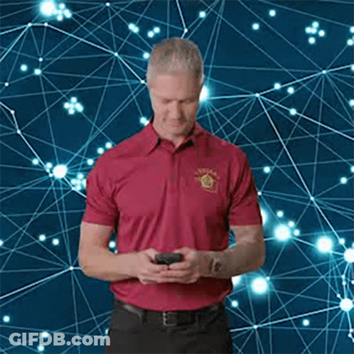 Man In Red Shirt Looking At Phone GIF