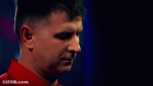 Man In Red Shirt Looking Down GIF