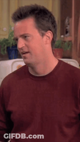 Man In Red Shirt Making Face With Eyes Closed GIF