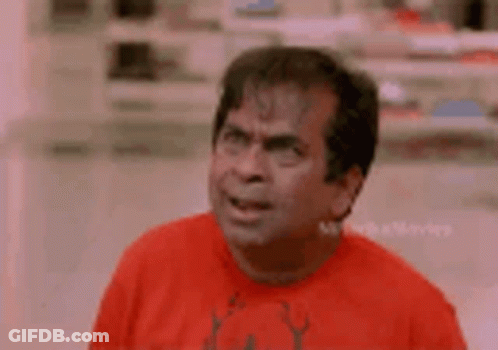 Man In Red Shirt Making Funny Face GIF