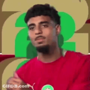 Man In Red Shirt Making Funny Face On Green Background GIF