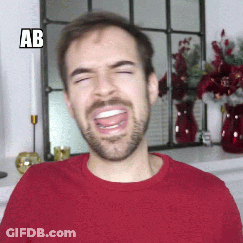 Man In Red Shirt Making Funny Face With AB GIF