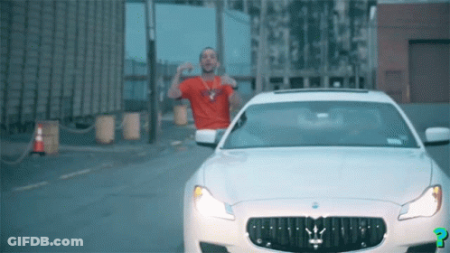 Man In Red Shirt Next To White Maserati GIF