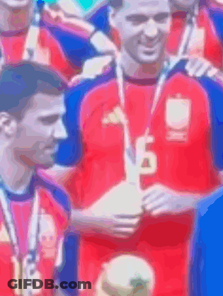 Man In Red Shirt Number 18 Holding Trophy GIF