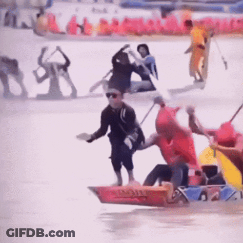 Man In Red Shirt On Triathlon Boat GIF