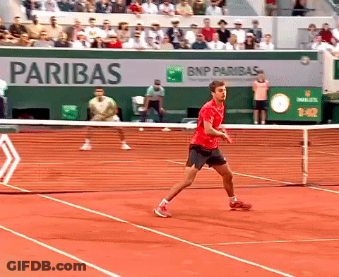 Man In Red Shirt Playing Tennis By BNP Paribas Ad GIF