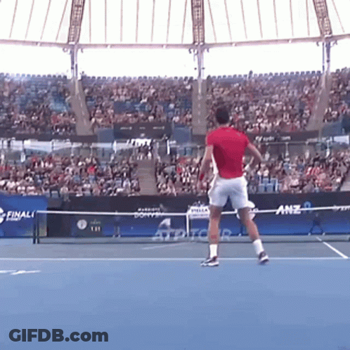 Man In Red Shirt Playing Tennis GIF