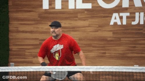 Man In Red Shirt Playing Tennis The On At Ji GIF